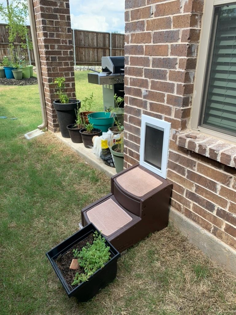 Pet door installed in brick wall exterior by Pet Door Pros